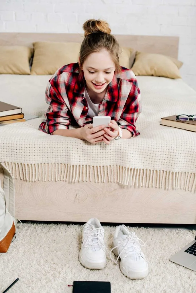 Teen setting phone down before bedtime